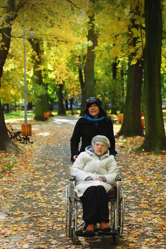 Live-in Carer with Elderly woman in the park